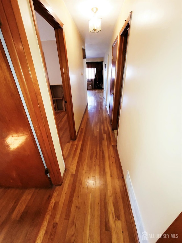 694 Vincent Pl, Perth Amboy, NJ 08861 - corridor with hardwood / wood-style flooring