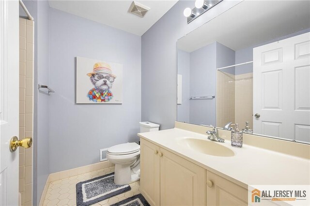 202 Canterbury Way S, Brunswick, NJ 08540 - bathroom with toilet, vanity, baseboards, a shower, and tile patterned flooring