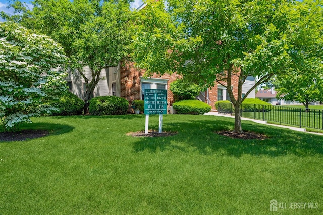 114 Griggs Pl E, Brunswick, NJ 08816 - view of front facade featuring brick siding