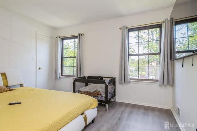 114 Griggs Pl E, Brunswick, NJ 08816 - bedroom featuring wood finished floors and baseboards