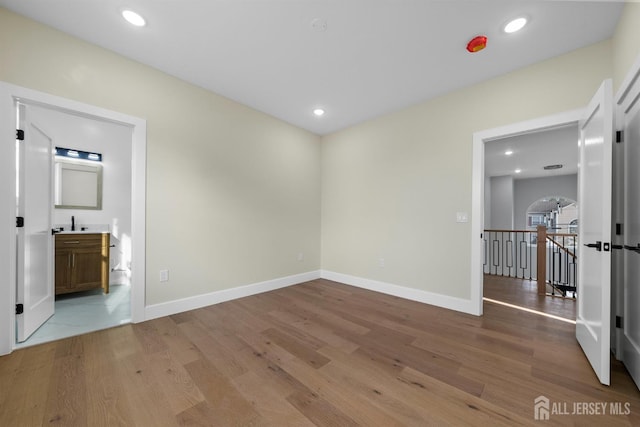 75 Jefferson Blvd, Edison, NJ 08817 - unfurnished room featuring wood finished floors, a sink, baseboards, and recessed lighting