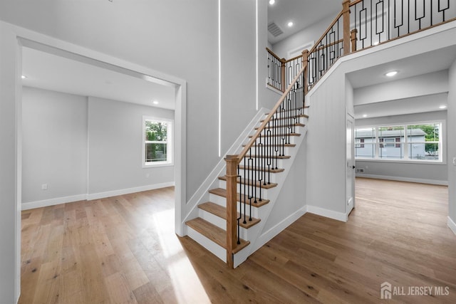 75 Jefferson Blvd, Edison, NJ 08817 - stairs featuring wood finished floors, recessed lighting, baseboards, and a high ceiling