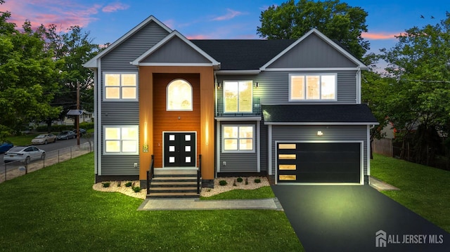 75 Jefferson Blvd, Edison, NJ 08817 - contemporary house featuring a garage, asphalt driveway, and roof with shingles