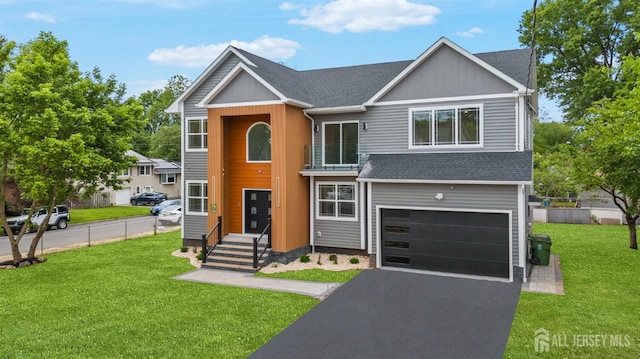 75 Jefferson Blvd, Edison, NJ 08817 - traditional home with a garage, roof with shingles, board and batten siding, and asphalt driveway