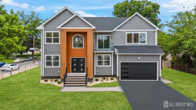 75 Jefferson Blvd, Edison, NJ 08817 - view of front facade featuring a shingled roof, an attached garage, and driveway