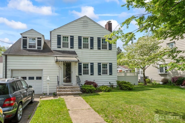 434 Orchard St, Rahway, NJ 07065 - view of front of property featuring a chimney, a front yard, driveway, and a shingled roof