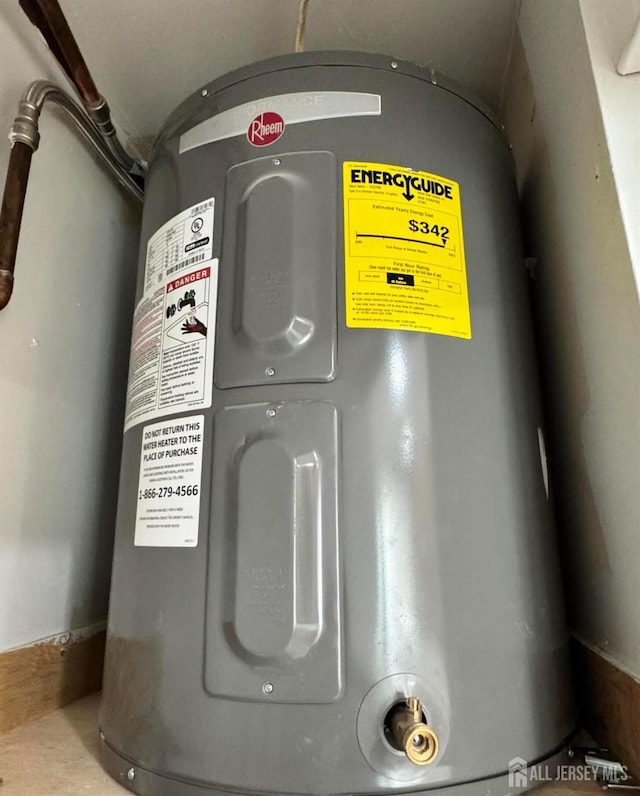 utility room featuring electric water heater