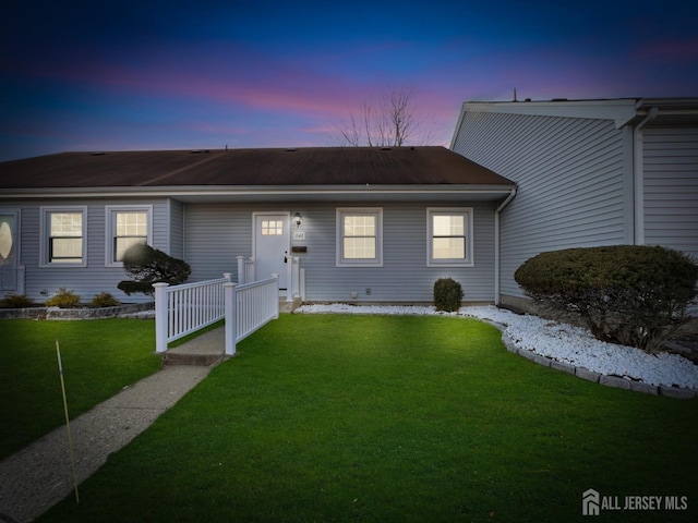 ranch-style house with a front lawn