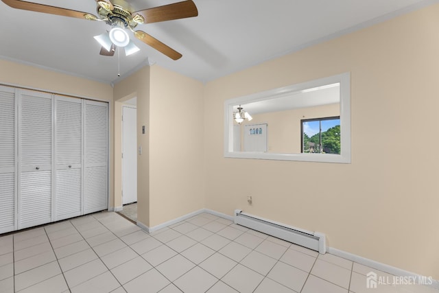 1004 Cricket Ln, Woodbridge Proper, NJ 07095 - unfurnished bedroom with a baseboard heating unit, a closet, a ceiling fan, a chandelier, and light tile patterned flooring