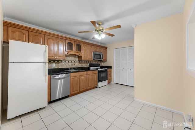 1004 Cricket Ln, Woodbridge Proper, NJ 07095 - kitchen featuring stainless steel appliances, backsplash, a ceiling fan, and brown cabinetry