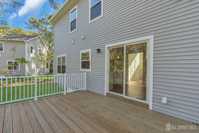 wooden deck with a yard