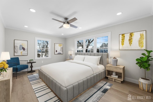 bedroom with baseboards, light wood-style floors, recessed lighting, and crown molding