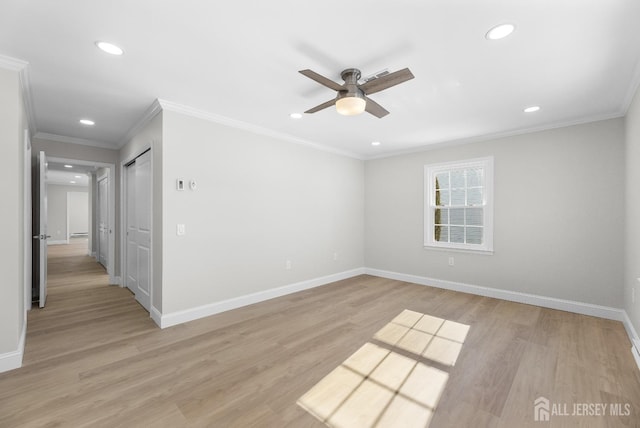 unfurnished room with light wood-type flooring, baseboards, crown molding, and recessed lighting