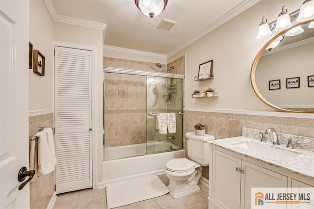 22 Kentnor St, Metuchen, NJ 08840 - full bath with tile walls, vanity, toilet, tile patterned flooring, and shower / bath combination with glass door