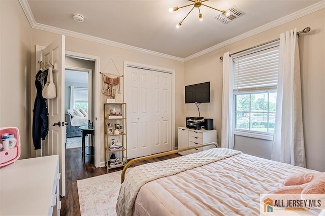 22 Kentnor St, Metuchen, NJ 08840 - bedroom with dark wood-style floors, crown molding, a closet, and a chandelier