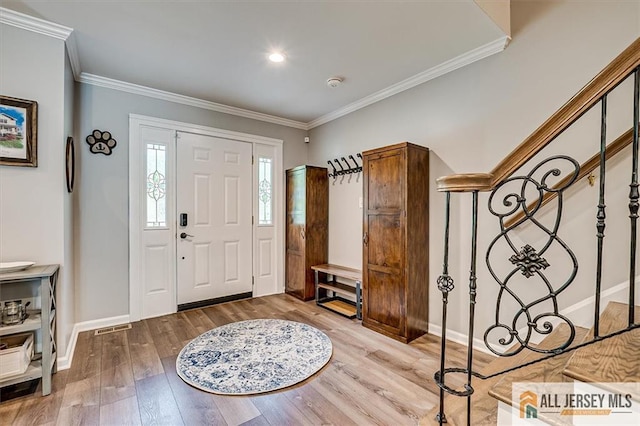 22 Kentnor St, Metuchen, NJ 08840 - foyer with wood finished floors, ornamental molding, and baseboards