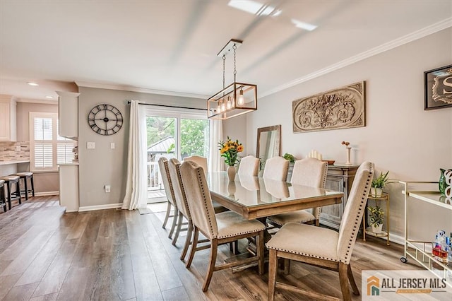 22 Kentnor St, Metuchen, NJ 08840 - dining room with crown molding, wood finished floors, and baseboards