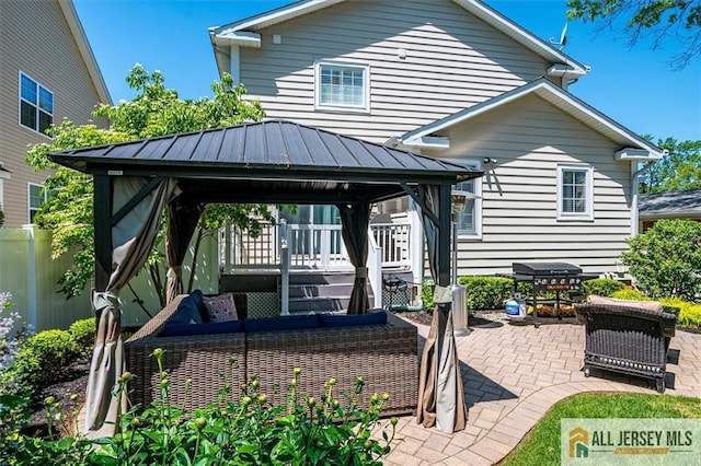22 Kentnor St, Metuchen, NJ 08840 - rear view of property with a gazebo, a patio, a standing seam roof, outdoor lounge area, and metal roof