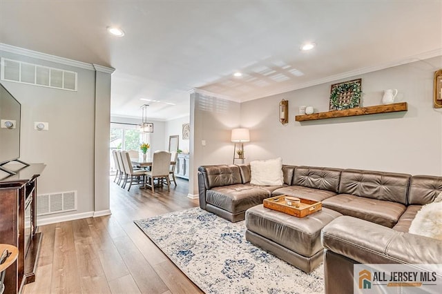 22 Kentnor St, Metuchen, NJ 08840 - living area featuring ornamental molding, light wood finished floors, recessed lighting, and baseboards