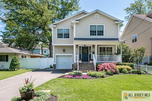 22 Kentnor St, Metuchen, NJ 08840 - view of front of house with a porch, asphalt driveway, and an attached garage