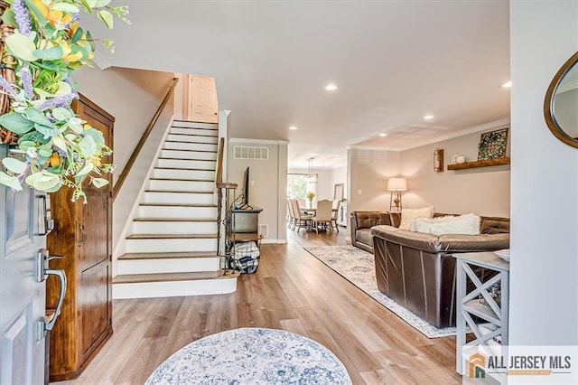 22 Kentnor St, Metuchen, NJ 08840 - foyer with stairway, light wood finished floors, crown molding, recessed lighting, and baseboards