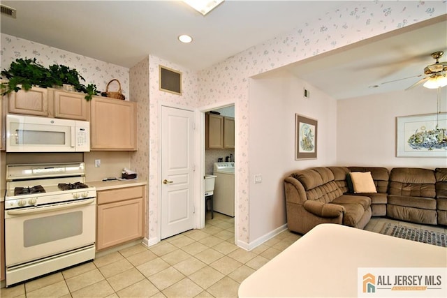 525 Harrier Dr Unit 525, Monroe, NJ 08831 - kitchen with white appliances, wallpapered walls, open floor plan, light tile patterned flooring, and light countertops