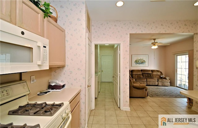 525 Harrier Dr Unit 525, Monroe, NJ 08831 - kitchen featuring white appliances, wallpapered walls, light tile patterned flooring, light countertops, and open floor plan