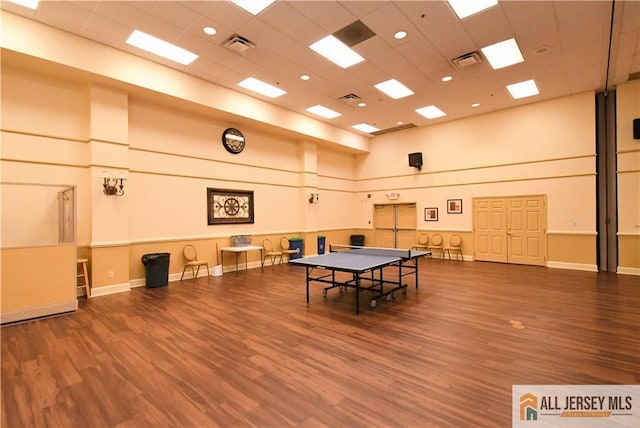 525 Harrier Dr Unit 525, Monroe, NJ 08831 - playroom featuring a high ceiling, wood finished floors, a drop ceiling, and baseboards