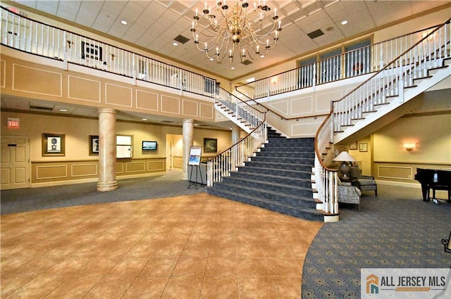 525 Harrier Dr Unit 525, Monroe, NJ 08831 - common area featuring a decorative wall, a high ceiling, stairs, recessed lighting, and wainscoting