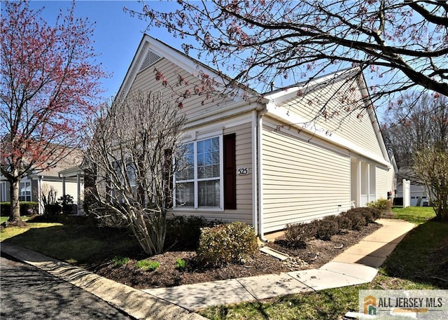525 Harrier Dr Unit 525, Monroe, NJ 08831 - view of side of home with a yard