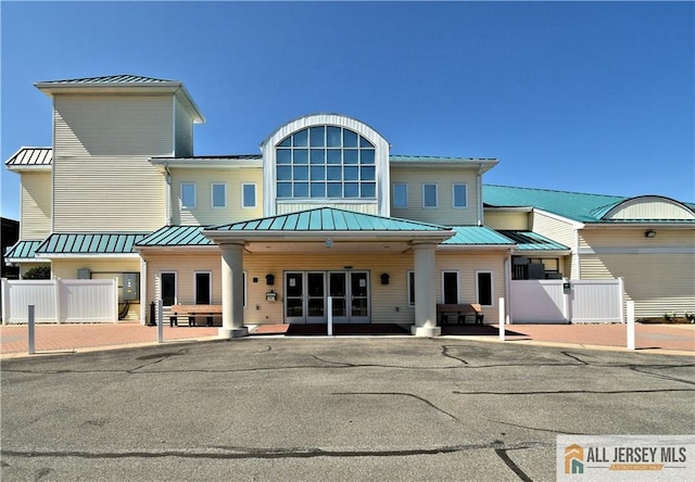 525 Harrier Dr Unit 525, Monroe, NJ 08831 - rear view of property featuring a standing seam roof, french doors, and fence