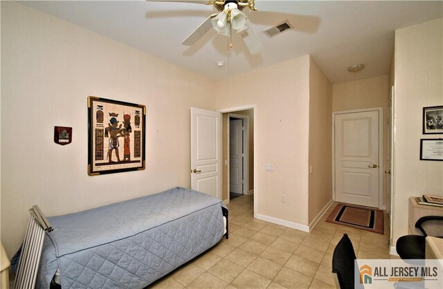 525 Harrier Dr Unit 525, Monroe, NJ 08831 - bedroom with light tile patterned flooring, a ceiling fan, and baseboards