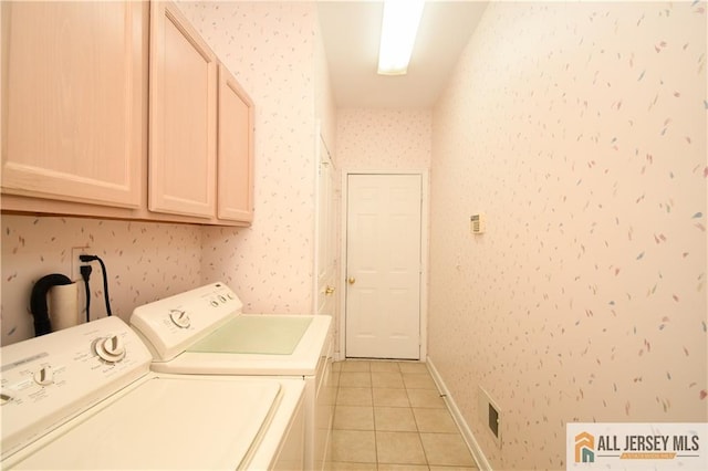 525 Harrier Dr Unit 525, Monroe, NJ 08831 - laundry area with cabinet space, washer and clothes dryer, wallpapered walls, light tile patterned floors, and baseboards