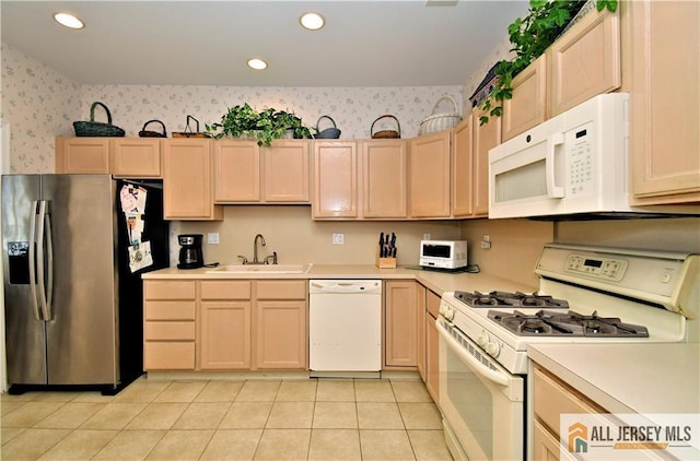 525 Harrier Dr Unit 525, Monroe, NJ 08831 - kitchen with white appliances, a sink, light brown cabinetry, wallpapered walls, and recessed lighting