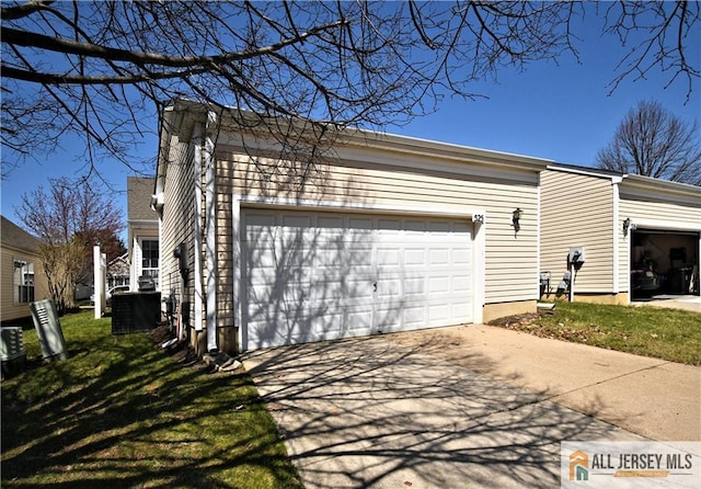 525 Harrier Dr Unit 525, Monroe, NJ 08831 - view of property exterior featuring concrete driveway and a yard