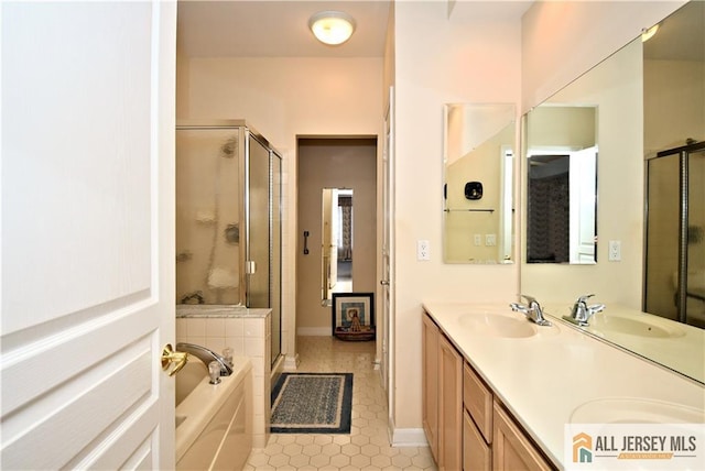 525 Harrier Dr Unit 525, Monroe, NJ 08831 - full bathroom featuring a garden tub, a shower stall, double vanity, tile patterned flooring, and baseboards