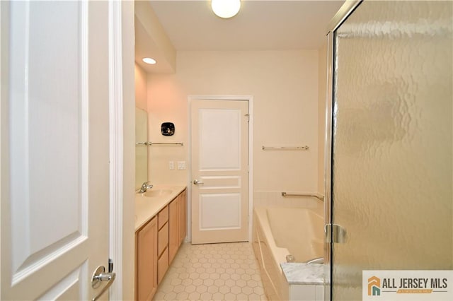 525 Harrier Dr Unit 525, Monroe, NJ 08831 - full bath featuring vanity, a garden tub, and a shower with door
