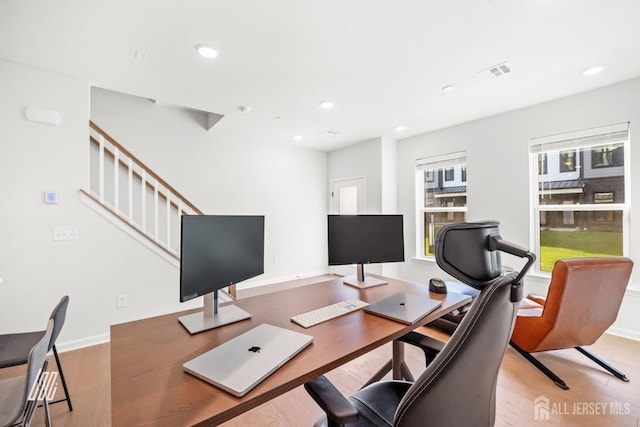 office area with light hardwood / wood-style floors