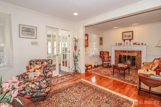 217 Midland Ave, Metuchen, NJ 08840 - living room featuring wood finished floors, french doors, ornamental molding, a fireplace, and recessed lighting