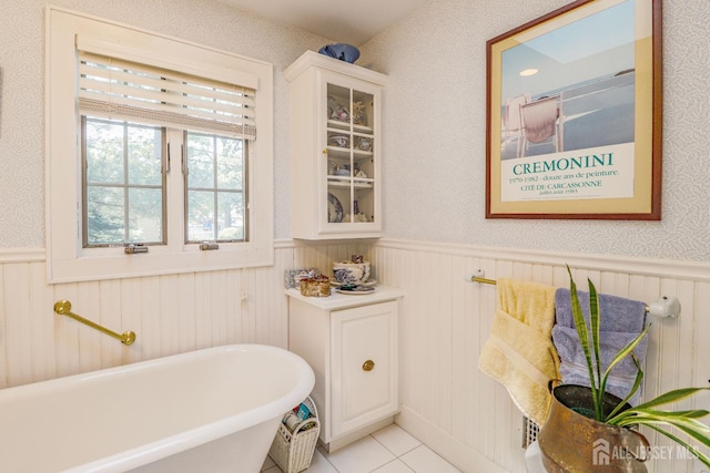 217 Midland Ave, Metuchen, NJ 08840 - bathroom with a wainscoted wall, a freestanding bath, and tile patterned flooring