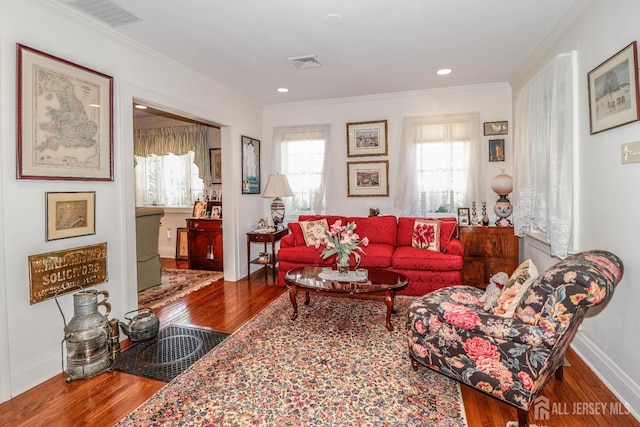 217 Midland Ave, Metuchen, NJ 08840 - living room with healthy amount of natural light, wood finished floors, crown molding, baseboards, and recessed lighting