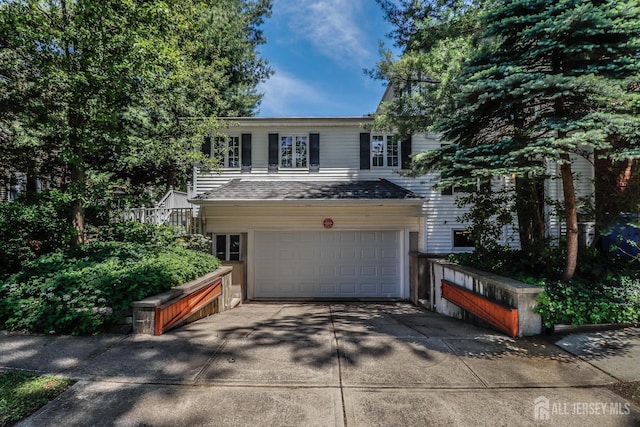 217 Midland Ave, Metuchen, NJ 08840 - view of front of property featuring an attached garage and driveway