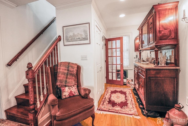 217 Midland Ave, Metuchen, NJ 08840 - entryway with wood finished floors, stairway, crown molding, recessed lighting, and bar area