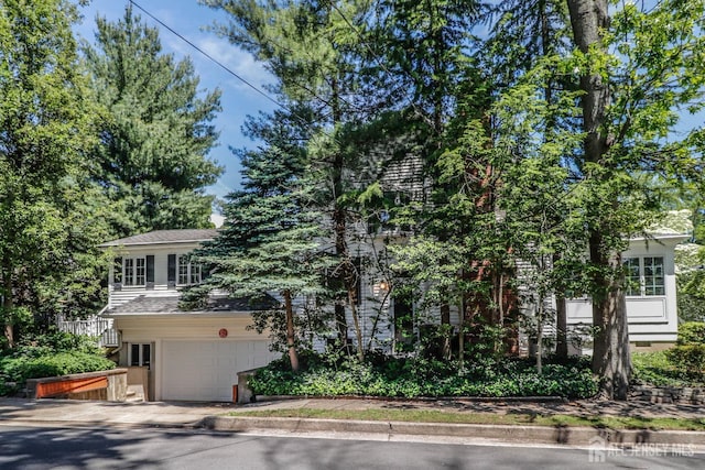 217 Midland Ave, Metuchen, NJ 08840 - view of property hidden behind natural elements featuring a garage
