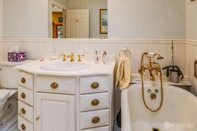 217 Midland Ave, Metuchen, NJ 08840 - bathroom with toilet, wainscoting, vanity, and a bathtub