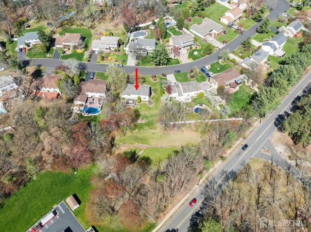 aerial overview of property's location with nearby suburban area