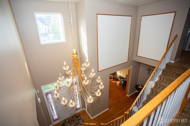 room details with hardwood / wood-style flooring and a chandelier