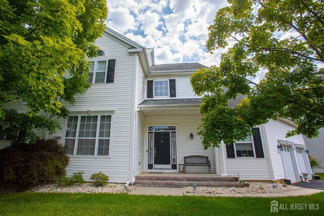 front of property with a garage