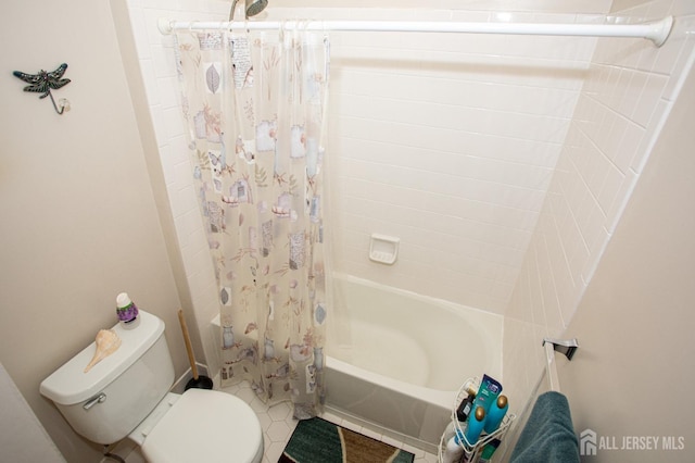 bathroom with toilet and shower / bath combo