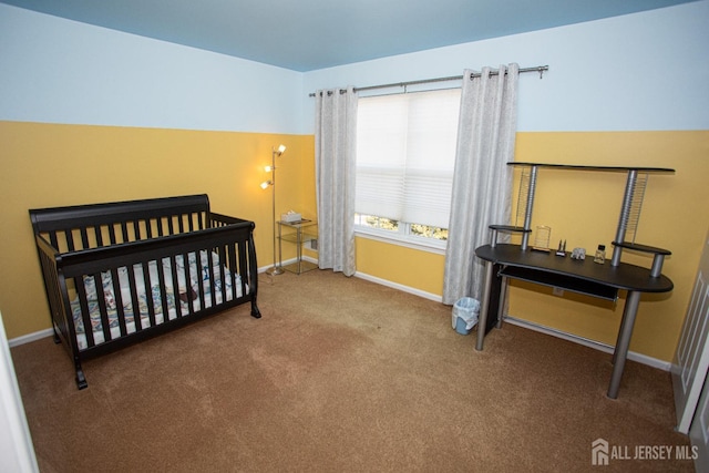 carpeted bedroom with a crib